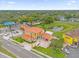 Aerial view of a commercial building with ample parking and surrounding businesses at 7440 Aloma Ave, Winter Park, FL 32792