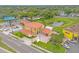 An aerial view showing a house with a parking lot, and neighboring businesses at 7440 Aloma Ave, Winter Park, FL 32792