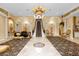 Elegant living room showcasing a dramatic staircase and high ceilings at 7440 Aloma Ave, Winter Park, FL 32792