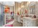 Bathroom with and vanities and ornate mirrors at 7440 Aloma Ave, Winter Park, FL 32792