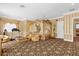 Opulent main bedroom with a large four-poster bed and sitting area at 7440 Aloma Ave, Winter Park, FL 32792