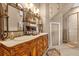 Primary bathroom with double vanity and ornate mirror at 7440 Aloma Ave, Winter Park, FL 32792