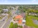 An aerial shot showcasing a house's location near a busy road and other buildings at 7440 Aloma Ave, Winter Park, FL 32792