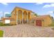 Two-story Mediterranean home with tile roof and attached garage at 7440 Aloma Ave, Winter Park, FL 32792