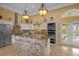 Gourmet kitchen with granite countertops and stainless steel appliances at 7440 Aloma Ave, Winter Park, FL 32792