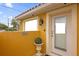 Inviting office entrance with glass door and landscaping at 7440 Aloma Ave, Winter Park, FL 32792