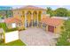 Luxury two-story home with tile roof and large driveway at 7440 Aloma Ave, Winter Park, FL 32792