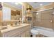 Elegant bathroom with a soaking tub, glass shower, and updated vanity at 7440 Aloma Ave, Winter Park, FL 32792
