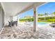 Spacious backyard oasis with a pool, spa, patio furniture, and dining area at 7766 Westland Dr, Kissimmee, FL 34747
