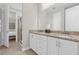 Bathroom boasts double sinks, granite countertops, and a walk-in shower at 7766 Westland Dr, Kissimmee, FL 34747