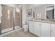 Clean bathroom with granite countertop and walk-in shower at 7766 Westland Dr, Kissimmee, FL 34747