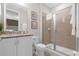 Bathroom with granite vanity and walk-in shower at 7766 Westland Dr, Kissimmee, FL 34747