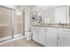 Clean bathroom with granite countertop and walk-in shower at 7766 Westland Dr, Kissimmee, FL 34747