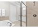 Bathroom with a soaking tub and walk-in shower at 7766 Westland Dr, Kissimmee, FL 34747