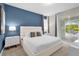 Main bedroom with king-size bed and access to the pool area at 7766 Westland Dr, Kissimmee, FL 34747