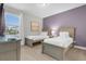 Bedroom with two twin beds and neutral color palette at 7766 Westland Dr, Kissimmee, FL 34747