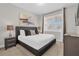 King bedroom with a large window and modern decor at 7766 Westland Dr, Kissimmee, FL 34747