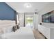 Bright bedroom with king bed, pool view, and sliding door access at 7766 Westland Dr, Kissimmee, FL 34747