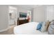Spacious bedroom with ensuite bathroom and large TV at 7766 Westland Dr, Kissimmee, FL 34747
