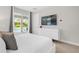 Bedroom with a king-size bed and sliding glass doors leading to the pool at 7766 Westland Dr, Kissimmee, FL 34747