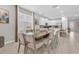 Spacious dining room with large glass table and six chairs at 7766 Westland Dr, Kissimmee, FL 34747