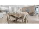 Large dining area with seating for eight, adjacent to kitchen and living room at 7766 Westland Dr, Kissimmee, FL 34747