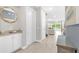 Entryway with console table, storage cabinets, and view to living area at 7766 Westland Dr, Kissimmee, FL 34747