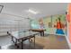 Game room with ping pong table and pool table at 7766 Westland Dr, Kissimmee, FL 34747
