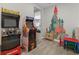 Play area with arcade games and castle mural at 7766 Westland Dr, Kissimmee, FL 34747