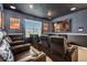Home theater with large screen and comfortable seating at 7766 Westland Dr, Kissimmee, FL 34747