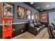 Home theater with black recliner seating and popcorn machine at 7766 Westland Dr, Kissimmee, FL 34747