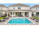 Large, inviting pool and spa with plenty of lounge chairs at 7766 Westland Dr, Kissimmee, FL 34747