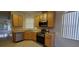 Kitchen with light wood cabinets, stainless steel appliances, and tile floor at 836 Grand Canal Dr, Kissimmee, FL 34759