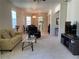 Bright and spacious living room with comfortable seating and large TV at 836 Grand Canal Dr, Kissimmee, FL 34759