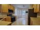 Eat-in kitchen with stainless steel appliances and ample cabinet space at 836 Grand Canal Dr, Kissimmee, FL 34759