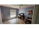 Spacious bedroom with large window and wood-look floors at 871 Lake Jackson Cir, Apopka, FL 32703