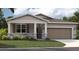 One-story home with two-car garage and stone accents at 871 Pebble Crest Ln, Eagle Lake, FL 33839