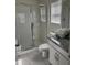 Clean bathroom with a shower stall, toilet and granite countertop vanity at 8918 Tropical Haven Ct, Kissimmee, FL 34747