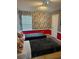 ' bedroom with twin beds and comic book wallpaper at 8918 Tropical Haven Ct, Kissimmee, FL 34747