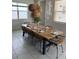 Dining room with a long wooden table and wicker chairs at 8918 Tropical Haven Ct, Kissimmee, FL 34747