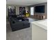Spacious game room with sectional sofa and large screen TV at 8918 Tropical Haven Ct, Kissimmee, FL 34747