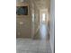 Bright hallway with light tile flooring and neutral walls at 8918 Tropical Haven Ct, Kissimmee, FL 34747
