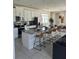 Spacious kitchen with an island, white cabinets, and granite countertops at 8918 Tropical Haven Ct, Kissimmee, FL 34747