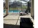 Relaxing pool and spa area with patio furniture and lush landscaping at 8918 Tropical Haven Ct, Kissimmee, FL 34747