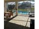 Screened pool and spa with patio furniture and outdoor dining at 8918 Tropical Haven Ct, Kissimmee, FL 34747
