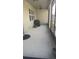 Screened patio with a grill and ceiling fan at 8918 Tropical Haven Ct, Kissimmee, FL 34747