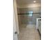 Large walk-in shower with neutral tile and glass enclosure at 8918 Tropical Haven Ct, Kissimmee, FL 34747