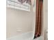 Simple bathroom with shower/tub combo at 1460 Reunion Blvd, Reunion, FL 34747