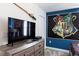 Bedroom with dresser, TV and themed wall decor at 1540 Maidstone Ct, Davenport, FL 33896