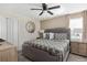 King-size bed with gray bedding and a large mirror in a spacious bedroom at 1540 Maidstone Ct, Davenport, FL 33896